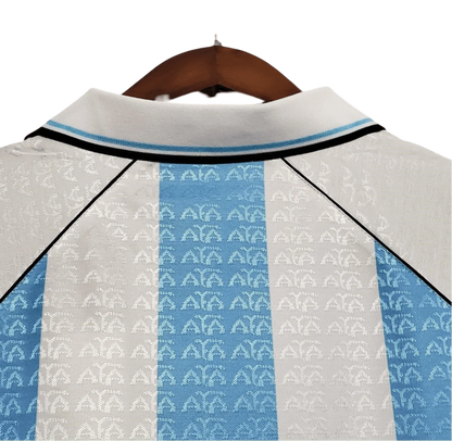 https://cdn.shopify.com/s/files/1/0826/7228/8075/files/19941996-argentina-home-retro-jersey-291210.webp?v=1741198526