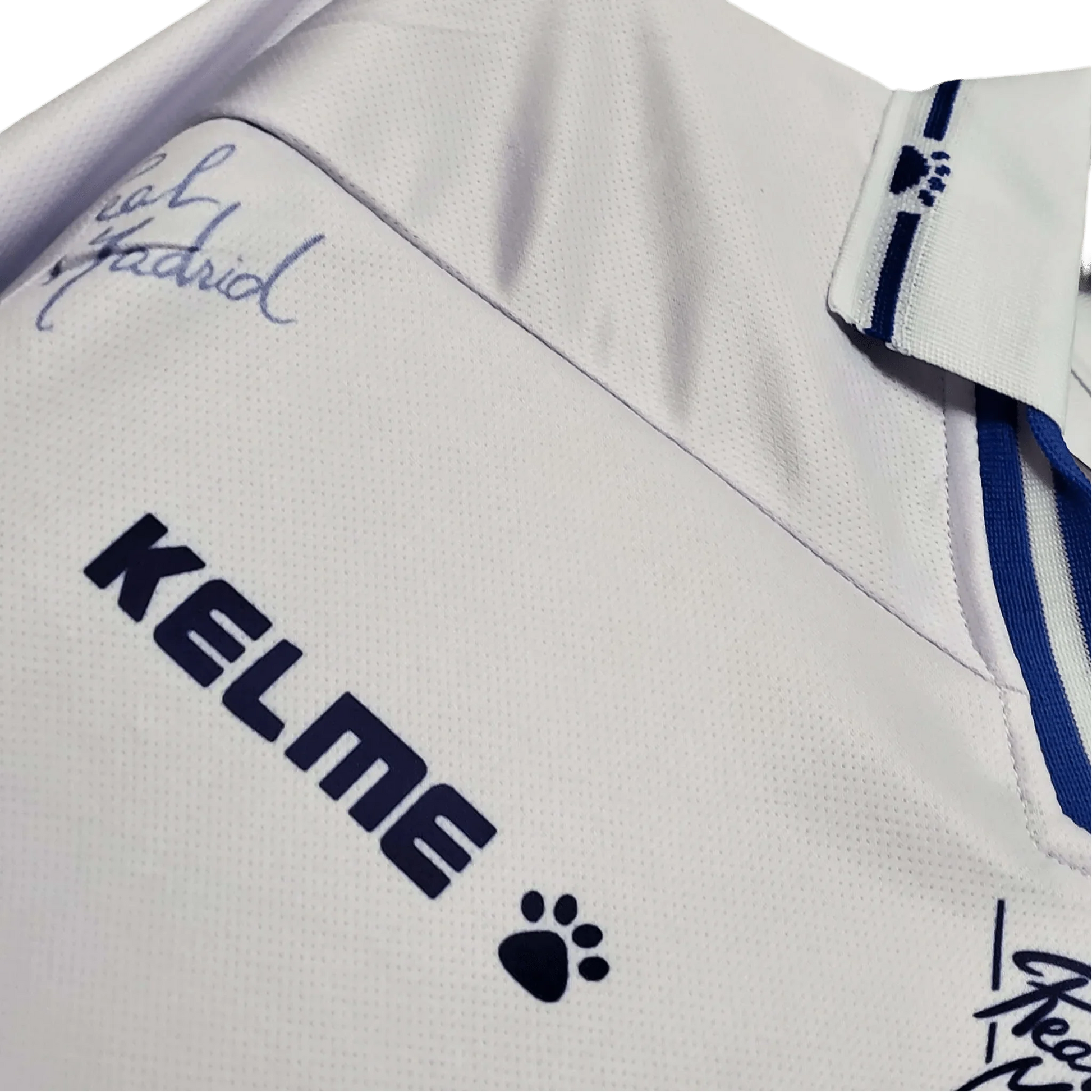 https://cdn.shopify.com/s/files/1/0826/7228/8075/files/19941996-real-madrid-teka-home-retro-kit-220040.webp?v=1741197465