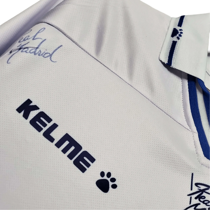 https://cdn.shopify.com/s/files/1/0826/7228/8075/files/19941996-real-madrid-teka-home-retro-kit-220040.webp?v=1741197465