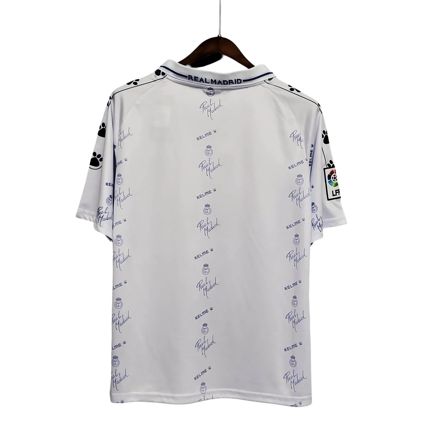 https://cdn.shopify.com/s/files/1/0826/7228/8075/files/19941996-real-madrid-teka-home-retro-kit-230711.webp?v=1741197464