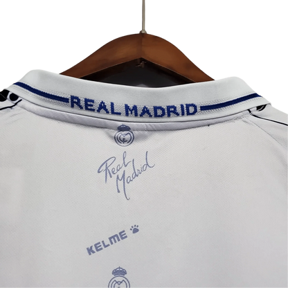 https://cdn.shopify.com/s/files/1/0826/7228/8075/files/19941996-real-madrid-teka-home-retro-kit-434563.webp?v=1741197467