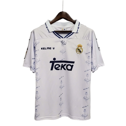 https://cdn.shopify.com/s/files/1/0826/7228/8075/files/19941996-real-madrid-teka-home-retro-kit-500979.webp?v=1741197465