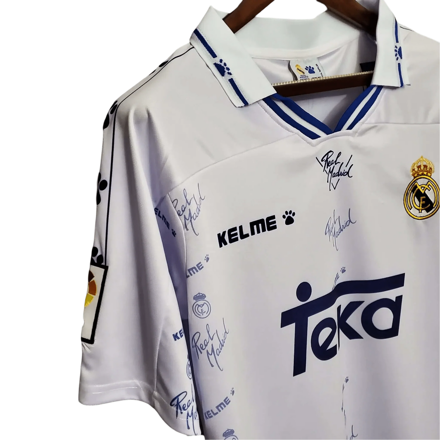 https://cdn.shopify.com/s/files/1/0826/7228/8075/files/19941996-real-madrid-teka-home-retro-kit-809673.webp?v=1741197465
