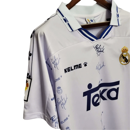 https://cdn.shopify.com/s/files/1/0826/7228/8075/files/19941996-real-madrid-teka-home-retro-kit-809673.webp?v=1741197465
