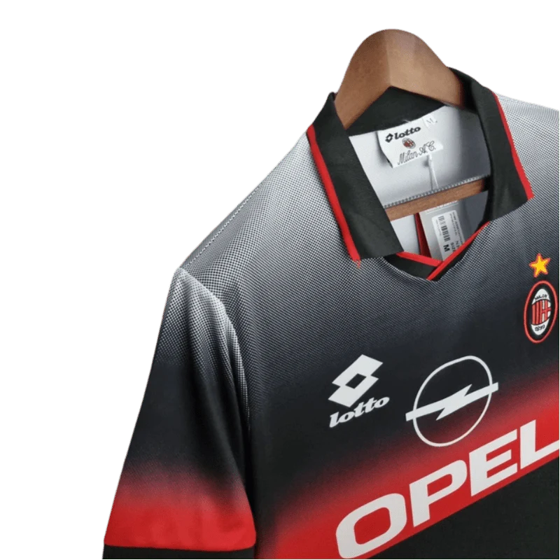 https://cdn.shopify.com/s/files/1/0826/7228/8075/files/19951996-ac-milan-opel-training-black-retro-kit-classickits433-466095.webp?v=1741198817