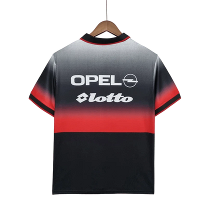 https://cdn.shopify.com/s/files/1/0826/7228/8075/files/19951996-ac-milan-opel-training-black-retro-kit-classickits433-486151.webp?v=1741198815