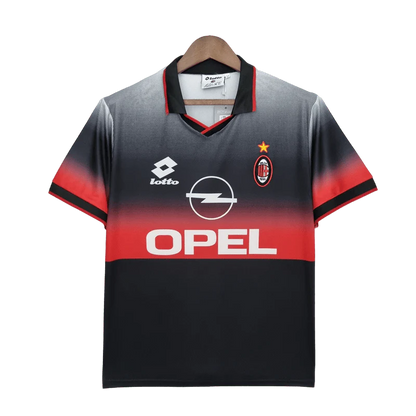 https://cdn.shopify.com/s/files/1/0826/7228/8075/files/19951996-ac-milan-opel-training-black-retro-kit-classickits433-729683.webp?v=1741198818