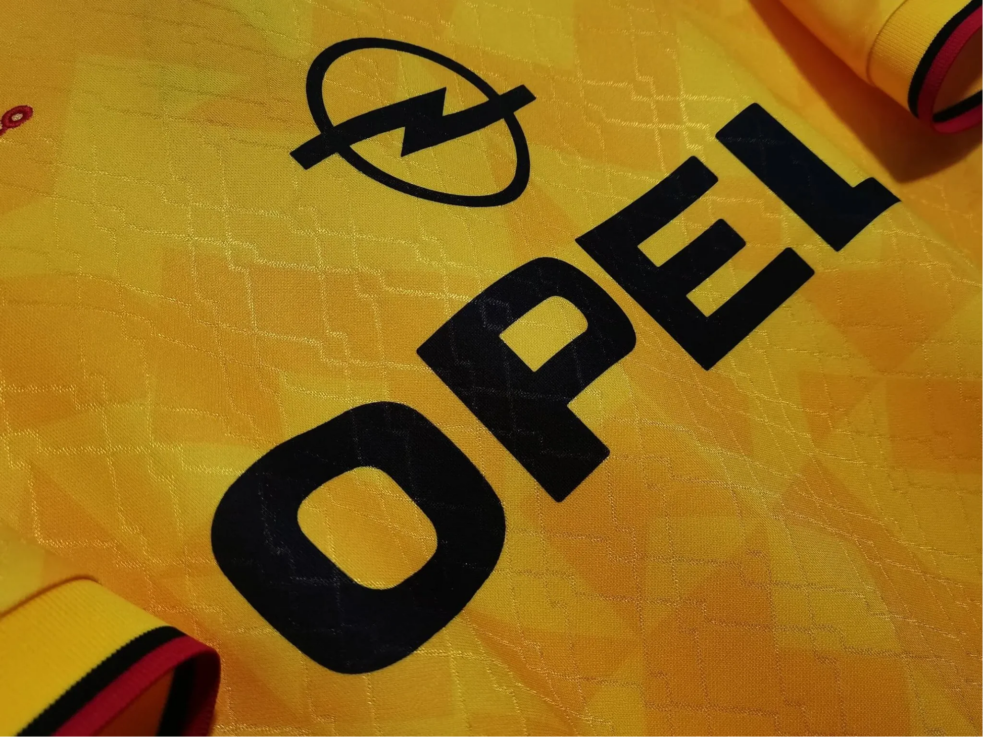https://cdn.shopify.com/s/files/1/0826/7228/8075/files/19951996-ac-milan-opel-yellow-3rd-away-retro-kit-437682.webp?v=1741197276