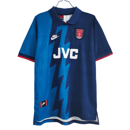 https://cdn.shopify.com/s/files/1/0826/7228/8075/files/19951996-arsenal-jvc-blue-away-retro-kit-classickits433-211434.webp?v=1741199336