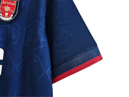 https://cdn.shopify.com/s/files/1/0826/7228/8075/files/19951996-arsenal-jvc-blue-away-retro-kit-classickits433-872069.webp?v=1741199336