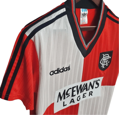 https://cdn.shopify.com/s/files/1/0826/7228/8075/files/19951996-glasgow-rangers-mcewans-lager-away-kit-classickits433-261971.webp?v=1741199016