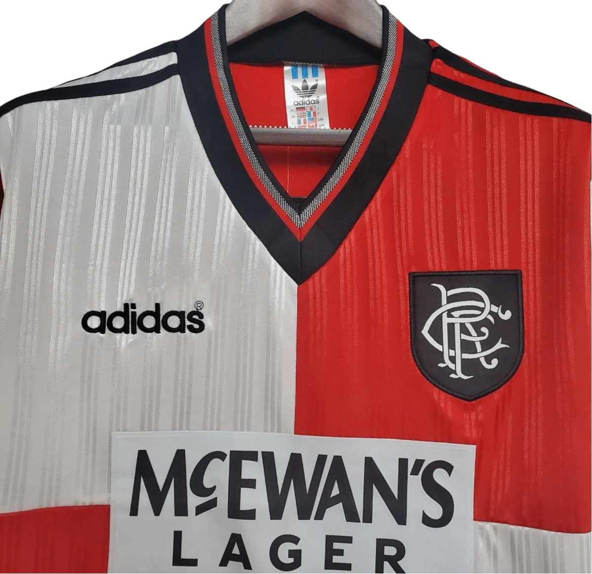 https://cdn.shopify.com/s/files/1/0826/7228/8075/files/19951996-glasgow-rangers-mcewans-lager-away-kit-classickits433-980783.webp?v=1741199017