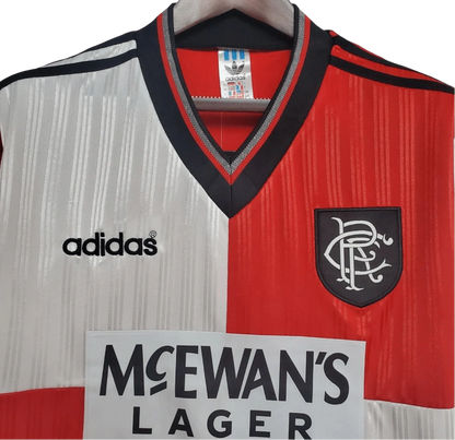 https://cdn.shopify.com/s/files/1/0826/7228/8075/files/19951996-glasgow-rangers-mcewans-lager-away-kit-classickits433-980783.webp?v=1741199017