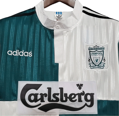 https://cdn.shopify.com/s/files/1/0826/7228/8075/files/19951996-liverpool-carlsberg-away-retro-kit-classickits433-377855.webp?v=1741199193