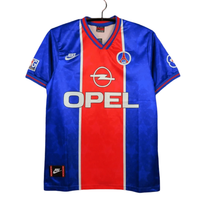 https://cdn.shopify.com/s/files/1/0826/7228/8075/files/19951996-paris-saint-germain-opel-home-retro-jersey-279832.webp?v=1741198001
