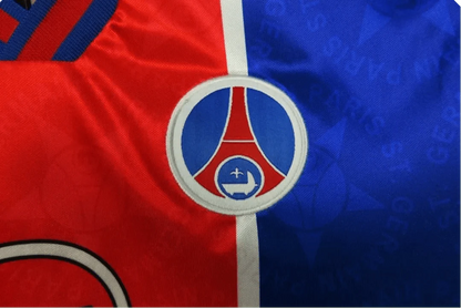 https://cdn.shopify.com/s/files/1/0826/7228/8075/files/19951996-paris-saint-germain-opel-home-retro-jersey-389212.webp?v=1741198002