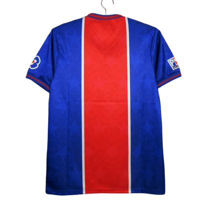 https://cdn.shopify.com/s/files/1/0826/7228/8075/files/19951996-paris-saint-germain-opel-home-retro-jersey-886557.webp?v=1741198000