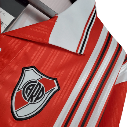https://cdn.shopify.com/s/files/1/0826/7228/8075/files/19951996-river-plate-quilmes-away-retro-jersey-615924.webp?v=1741197178