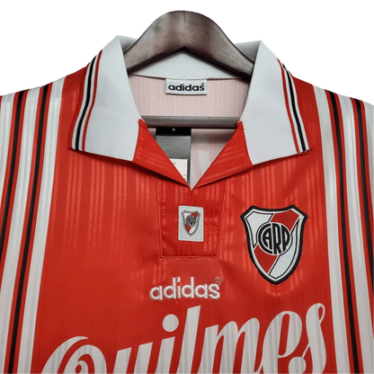 https://cdn.shopify.com/s/files/1/0826/7228/8075/files/19951996-river-plate-quilmes-away-retro-jersey-894575.webp?v=1741197179
