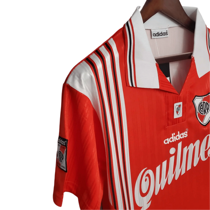 https://cdn.shopify.com/s/files/1/0826/7228/8075/files/19951996-river-plate-quilmes-away-retro-jersey-913180.webp?v=1741197183