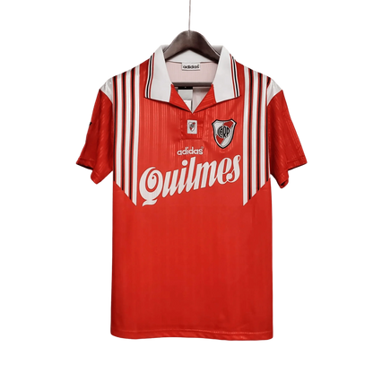 https://cdn.shopify.com/s/files/1/0826/7228/8075/files/19951996-river-plate-quilmes-away-retro-jersey-998996.webp?v=1741197181