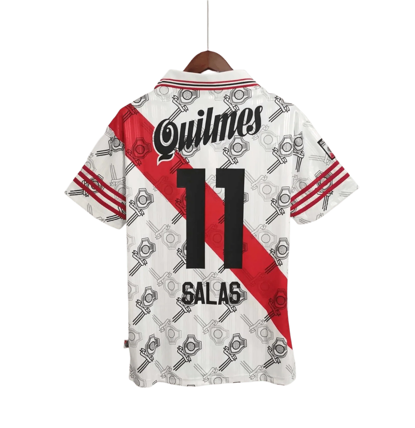 https://cdn.shopify.com/s/files/1/0826/7228/8075/files/19951996-river-plate-quilmes-home-retro-jersey-360224.webp?v=1741197181