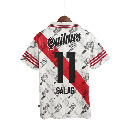 https://cdn.shopify.com/s/files/1/0826/7228/8075/files/19951996-river-plate-quilmes-home-retro-jersey-360224.webp?v=1741197181