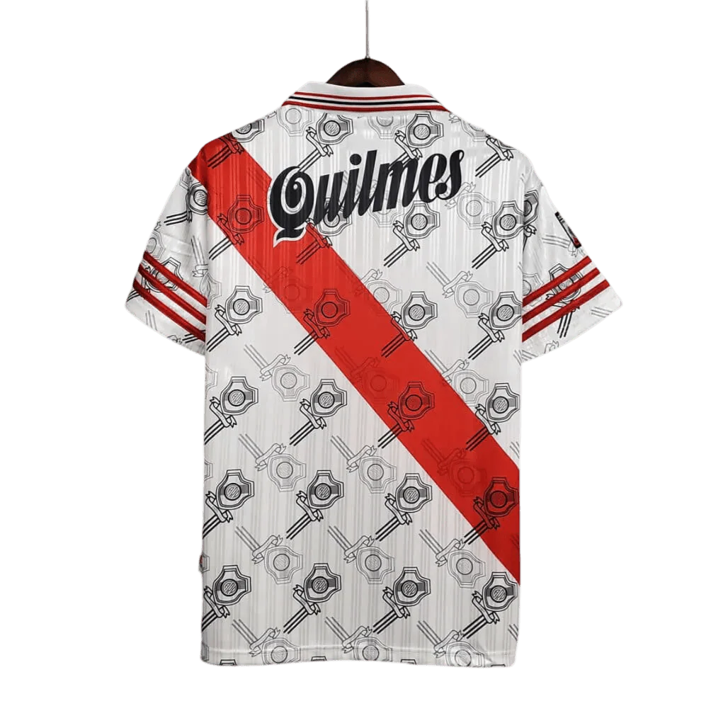https://cdn.shopify.com/s/files/1/0826/7228/8075/files/19951996-river-plate-quilmes-home-retro-jersey-823538.webp?v=1741197179
