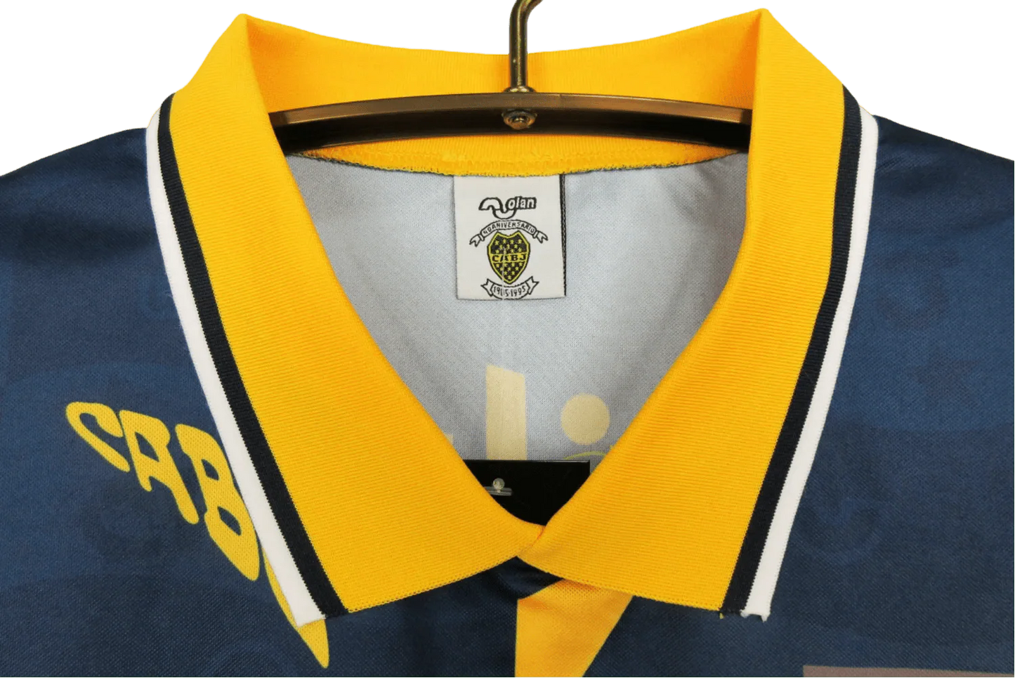 https://cdn.shopify.com/s/files/1/0826/7228/8075/files/19951997-boca-juniors-quilmes-home-retro-jersey-715764.webp?v=1741197188