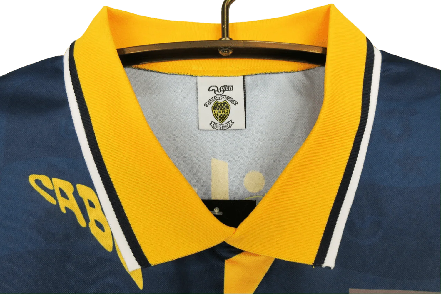https://cdn.shopify.com/s/files/1/0826/7228/8075/files/19951997-boca-juniors-quilmes-home-retro-jersey-715764.webp?v=1741197188