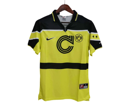 https://cdn.shopify.com/s/files/1/0826/7228/8075/files/1996-1997BorussiaDortmundContinentale-ThirdRetroShirt_6.webp?v=1735866551