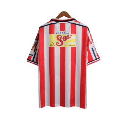 https://cdn.shopify.com/s/files/1/0826/7228/8075/files/19961997-chivas-guadalajara-mexicana-home-retro-jersey-282216.webp?v=1741197159