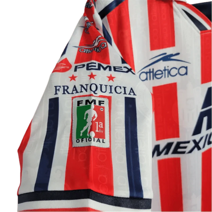 https://cdn.shopify.com/s/files/1/0826/7228/8075/files/19961997-chivas-guadalajara-mexicana-home-retro-jersey-403015.webp?v=1741197157