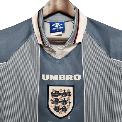 https://cdn.shopify.com/s/files/1/0826/7228/8075/files/19961997-england-away-retro-kit-classickits433-874544.webp?v=1741198526