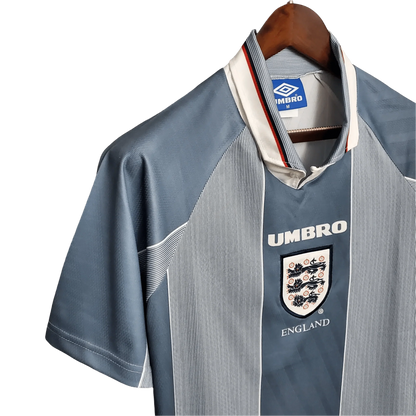 https://cdn.shopify.com/s/files/1/0826/7228/8075/files/19961997-england-away-retro-kit-classickits433-970687.webp?v=1741198525