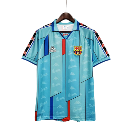 https://cdn.shopify.com/s/files/1/0826/7228/8075/files/19961997-fc-barcelona-turquoise-retro-kit-classickits433-318097.webp?v=1741199023