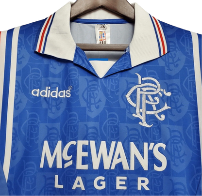https://cdn.shopify.com/s/files/1/0826/7228/8075/files/19961997-glasgow-rangers-mcewans-lager-home-kit-classickits433-265118.webp?v=1741199170