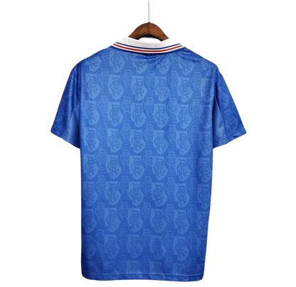 https://cdn.shopify.com/s/files/1/0826/7228/8075/files/19961997-glasgow-rangers-mcewans-lager-home-kit-classickits433-315123.webp?v=1741199169