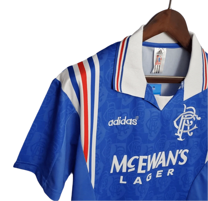 https://cdn.shopify.com/s/files/1/0826/7228/8075/files/19961997-glasgow-rangers-mcewans-lager-home-kit-classickits433-442636.webp?v=1741199172