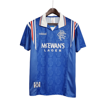 https://cdn.shopify.com/s/files/1/0826/7228/8075/files/19961997-glasgow-rangers-mcewans-lager-home-kit-classickits433-899453.webp?v=1741199168