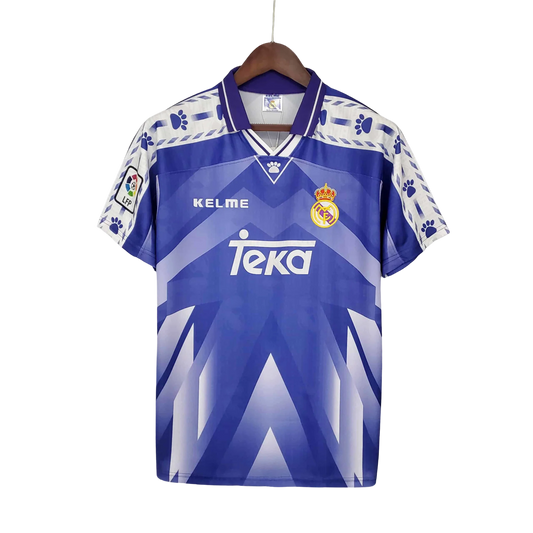 https://cdn.shopify.com/s/files/1/0826/7228/8075/files/19961997-real-madrid-teka-blue-away-retro-kit-classickits433-492912.webp?v=1741199046