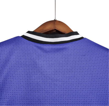 https://cdn.shopify.com/s/files/1/0826/7228/8075/files/19971998-real-madrid-teka-blue-away-retro-kit-classickits433-305948.webp?v=1741199033