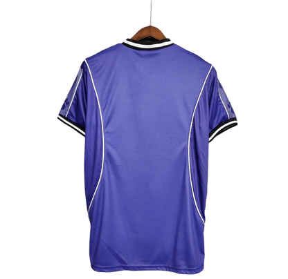 https://cdn.shopify.com/s/files/1/0826/7228/8075/files/19971998-real-madrid-teka-blue-away-retro-kit-classickits433-583435.webp?v=1741199032