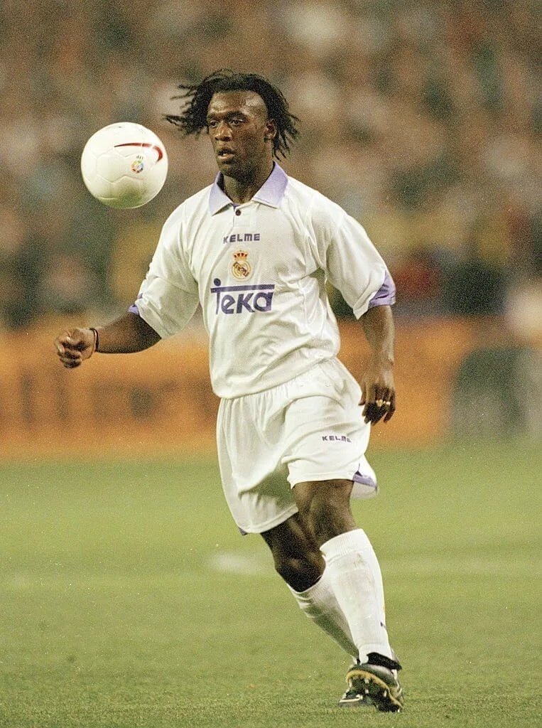 https://cdn.shopify.com/s/files/1/0826/7228/8075/files/19971998-real-madrid-teka-white-home-retro-kit-classickits433-997370.webp?v=1741199029