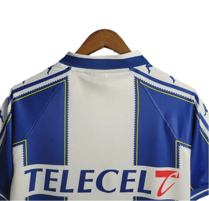 https://cdn.shopify.com/s/files/1/0826/7228/8075/files/19971999-fc-porto-revigres-home-retro-jersey-629128.webp?v=1741199350