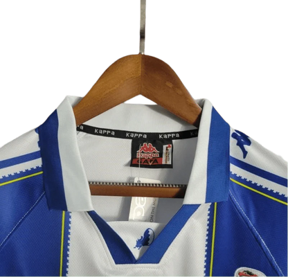 https://cdn.shopify.com/s/files/1/0826/7228/8075/files/19971999-fc-porto-revigres-home-retro-jersey-786490.webp?v=1741199349