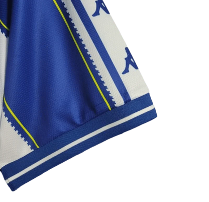 https://cdn.shopify.com/s/files/1/0826/7228/8075/files/19971999-fc-porto-revigres-home-retro-jersey-996146.webp?v=1741199348