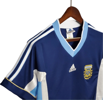 https://cdn.shopify.com/s/files/1/0826/7228/8075/files/1998-argentina-world-cup-away-retro-jersey-138332.webp?v=1741198527