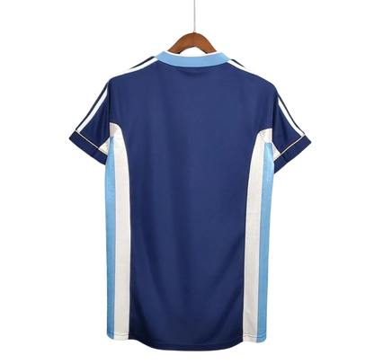 https://cdn.shopify.com/s/files/1/0826/7228/8075/files/1998-argentina-world-cup-away-retro-jersey-696677.webp?v=1741198525