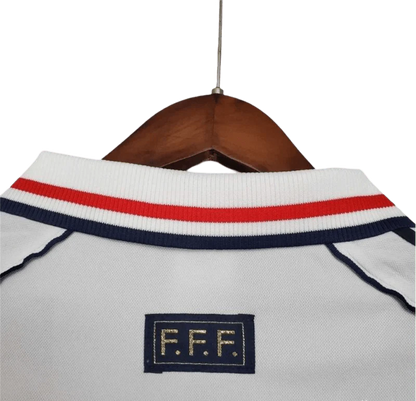 https://cdn.shopify.com/s/files/1/0826/7228/8075/files/1998-france-world-cup-away-retro-jersey-249546.webp?v=1741198517